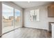 Bright dining area features sliding glass door access to deck and large window for natural light at 1321 Loraine N Cir, Lafayette, CO 80026