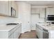Modern kitchen with stainless steel appliances, white countertops and gray cabinets at 1321 Loraine N Cir, Lafayette, CO 80026