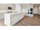 Modern kitchen with gray cabinets, white countertops, and stainless steel appliances, perfect for cooking at 1321 Loraine N Cir, Lafayette, CO 80026
