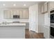 Contemporary kitchen with stainless steel appliances, white countertops and gray cabinets at 1321 Loraine N Cir, Lafayette, CO 80026