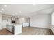 Open-concept kitchen and living room with hardwood floors and bright natural light at 1321 Loraine N Cir, Lafayette, CO 80026