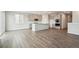 Open kitchen and living area with hardwood floors and abundant natural light at 1321 Loraine N Cir, Lafayette, CO 80026