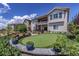 Backyard with putting green, stone walls, mature plants and trees at 21786 Tyrolite Ave, Parker, CO 80138