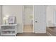 Bright hallway with multiple doorways and a view into another room at 21786 Tyrolite Ave, Parker, CO 80138