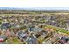 Aerial view of a neighborhood showcasing varied architectural styles, green spaces, and a sense of community at 9826 E 27Th Dr, Denver, CO 80238
