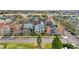 Aerial view showcasing the community's charming single-Gathering homes in a well-planned neighborhood with tree-lined streets at 9826 E 27Th Dr, Denver, CO 80238