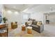 Spacious basement living area, perfect for entertaining or relaxing with comfortable seating and neutral decor at 9826 E 27Th Dr, Denver, CO 80238