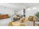 Basement living area with a wet bar, comfortable seating, and a cozy fireplace, perfect for entertaining guests at 9826 E 27Th Dr, Denver, CO 80238