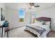 Bedroom filled with natural light, featuring a modern ceiling fan and neutral finishes at 9826 E 27Th Dr, Denver, CO 80238