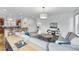 Spacious living room with modern décor, hardwood flooring, and an open layout at 9826 E 27Th Dr, Denver, CO 80238
