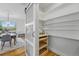 Walk-in pantry featuring ample shelving and storage space, with easy access to the dining area at 9826 E 27Th Dr, Denver, CO 80238