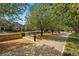 Picturesque park featuring blossoming trees, park benches, and a walking path in a Gathering friendly community at 9826 E 27Th Dr, Denver, CO 80238