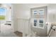 Staircase featuring white railing and neutral walls with windows for natural light at 9826 E 27Th Dr, Denver, CO 80238