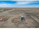 Aerial view of a home and detached garage on a rural property in Colorado at 253 E 8Th Ave, Byers, CO 80103