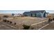 Fenced backyard with a storage shed, play area, and ample space for outdoor activities at 253 E 8Th Ave, Byers, CO 80103