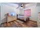 Charming bedroom featuring hardwood floors, a neutral color palette, and ample natural light at 253 E 8Th Ave, Byers, CO 80103