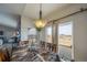 Inviting dining area with natural light and view, complements the wooden table set, creating a warm, inviting meal space at 253 E 8Th Ave, Byers, CO 80103