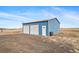 Large detached garage with two roll up doors and separate entry at 253 E 8Th Ave, Byers, CO 80103