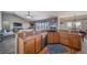 A well-equipped kitchen featuring wooden cabinetry, stainless steel appliances, and a practical layout for efficient meal preparation at 253 E 8Th Ave, Byers, CO 80103