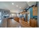 Bright, open kitchen with stainless steel appliances, ample wooden cabinets, and seamless flow to dining and living areas at 253 E 8Th Ave, Byers, CO 80103
