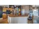 A well-appointed kitchen featuring stainless steel appliances, wooden cabinetry, and an inviting breakfast bar for casual dining at 253 E 8Th Ave, Byers, CO 80103