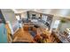 Open concept kitchen featuring a large island, seamlessly flowing into a stylish living room area at 253 E 8Th Ave, Byers, CO 80103