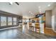 A bright, open-concept living area with views to the kitchen and ample natural light from large windows, creating a welcoming space at 253 E 8Th Ave, Byers, CO 80103