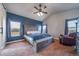 Spacious main bedroom with a decorative ceiling fan, large windows and a view to the outside at 253 E 8Th Ave, Byers, CO 80103