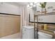 Stylish bathroom with a vanity, marble countertop, and ample storage, complemented by modern fixtures and decor at 1454 Jersey St # 2, Denver, CO 80220