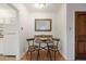 Cozy dining area featuring a modern table set, ample lighting, and decorative mirror at 1454 Jersey St # 2, Denver, CO 80220