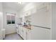 Bright kitchen featuring white cabinets, tile backsplash, modern sink and faucet, and gas range at 1454 Jersey St # 2, Denver, CO 80220