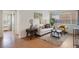 Bright living room featuring hardwood floors, white sofa, stylish decor, and natural light through the windows at 1454 Jersey St # 2, Denver, CO 80220