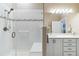 Modern bathroom featuring a glass-enclosed shower, double sinks, and contemporary fixtures at 12278 Stone Timber Ct, Parker, CO 80134