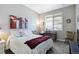 Comfortable bedroom with a cozy bed, natural light, and a functional workspace at 12278 Stone Timber Ct, Parker, CO 80134