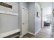 Functional entryway with a coat rack, bench, and door, offering a welcoming first impression at 12278 Stone Timber Ct, Parker, CO 80134