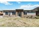 Inviting home exterior with stone accents, a well-maintained lawn, and a welcoming entrance at 12278 Stone Timber Ct, Parker, CO 80134