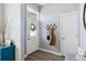 Inviting foyer features a coat rack, stylish door and updated flooring at 12278 Stone Timber Ct, Parker, CO 80134
