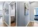 Hallway with views into the bathroom and living room, showcasing the home's layout at 12278 Stone Timber Ct, Parker, CO 80134