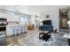 Open living space featuring a modern kitchen, dining area, and cozy living room at 12278 Stone Timber Ct, Parker, CO 80134