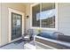 Charming patio with comfortable chair, black grill, and sliding glass door creating an inviting outdoor space at 12278 Stone Timber Ct, Parker, CO 80134
