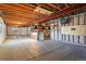 Unfinished basement with exposed beams, ductwork, and concrete floor presents customization opportunities at 4825 Basalt Ridge Cir, Castle Rock, CO 80108