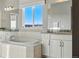 Bright bathroom with soaking tub, granite countertops, and dual sink vanity at 4825 Basalt Ridge Cir, Castle Rock, CO 80108