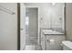 Bathroom featuring granite countertop and view through the doorway to an adjacent bedroom at 4825 Basalt Ridge Cir, Castle Rock, CO 80108