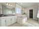 Bright bathroom features soaking tub, granite countertops, walk-in shower, and dual vanities at 4825 Basalt Ridge Cir, Castle Rock, CO 80108