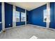 Vibrant bedroom featuring three large windows and comfortable carpeting for cozy living at 4825 Basalt Ridge Cir, Castle Rock, CO 80108