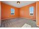 The bedroom is freshly painted with large windows and has clean carpeted floors at 4825 Basalt Ridge Cir, Castle Rock, CO 80108
