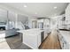 Open concept kitchen features a large island, stainless appliances, and seamless integration with the living area at 4825 Basalt Ridge Cir, Castle Rock, CO 80108