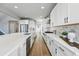 Bright kitchen with an island, stainless steel appliances, and white cabinets at 4825 Basalt Ridge Cir, Castle Rock, CO 80108