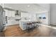 Modern kitchen featuring an island with seating, stainless steel appliances, and an open design at 4825 Basalt Ridge Cir, Castle Rock, CO 80108