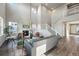 Spacious living room with high ceilings, a fireplace, and a staircase leading to the second floor at 4825 Basalt Ridge Cir, Castle Rock, CO 80108